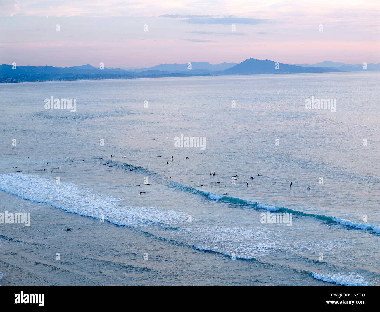 Surfers in the sea,Biarritz Stock Photo