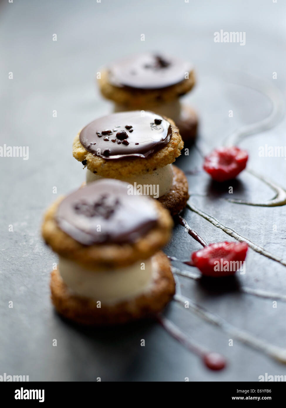 Profiterole-style chocolate cookie and vanilla ice cream dessert Stock Photo