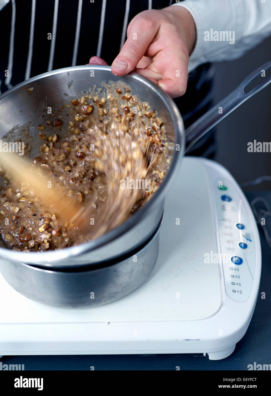Energetically mixing the ingredients Stock Photo