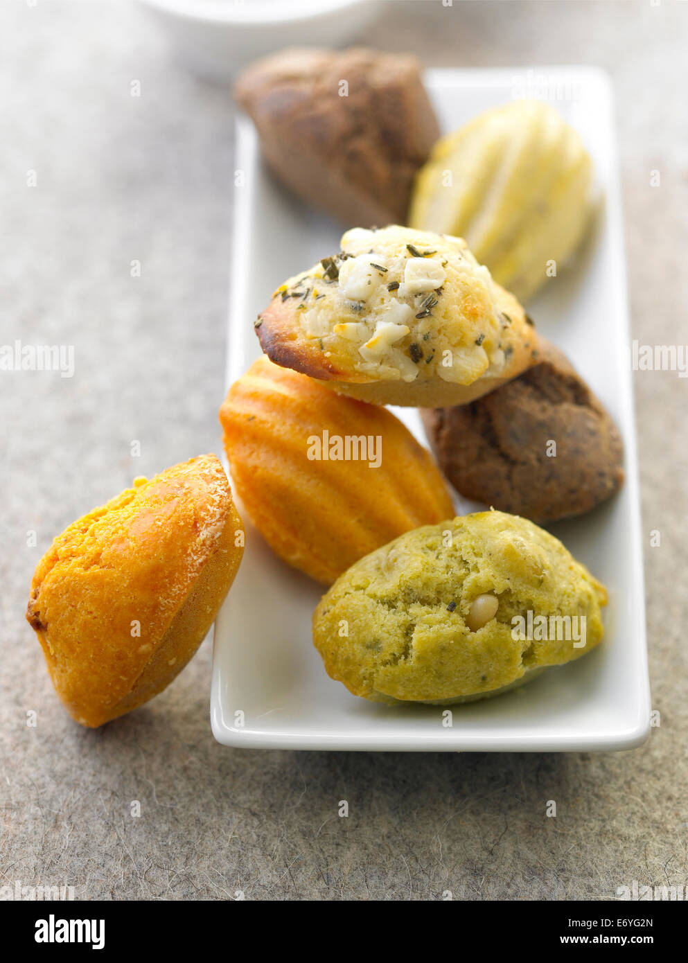 Different flavored savoury mini Madeleines Stock Photo