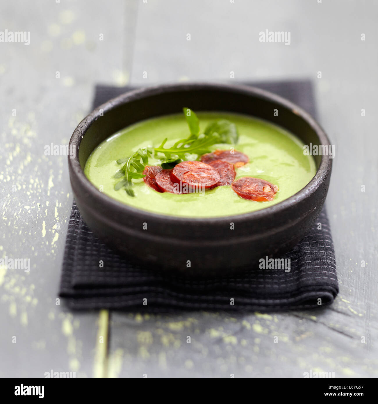 Cream of watercress and rocket lettuce soup with chorizo Stock Photo