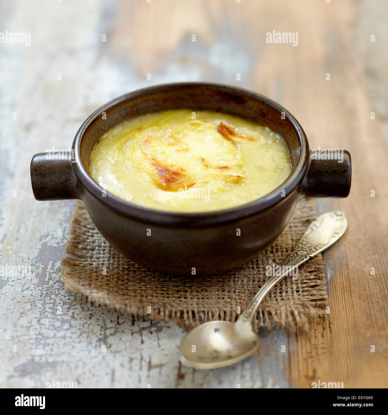 Cream of leek and potato soup with grilled Reblochon Stock Photo