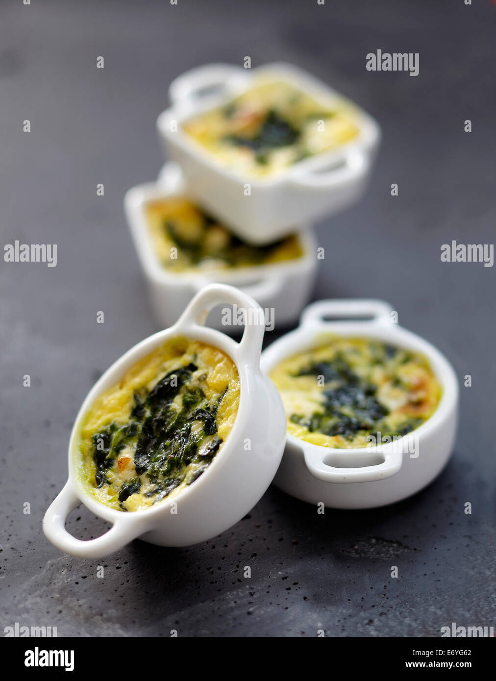 Spinach-Boursin mini casseroles Stock Photo