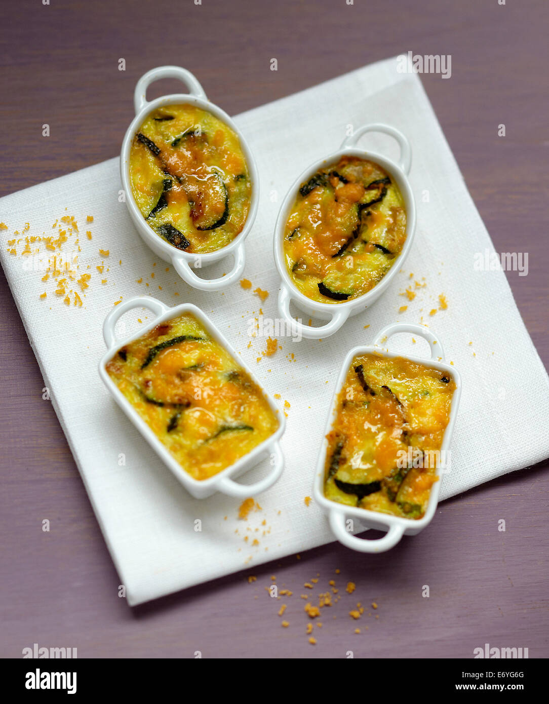 Zucchini and mimolette mini gratins Stock Photo