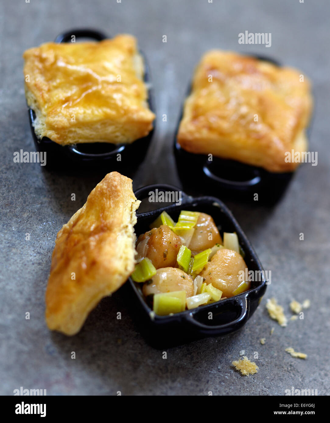 Petoncle scallop and leek casseroles sealed with pastry Stock Photo