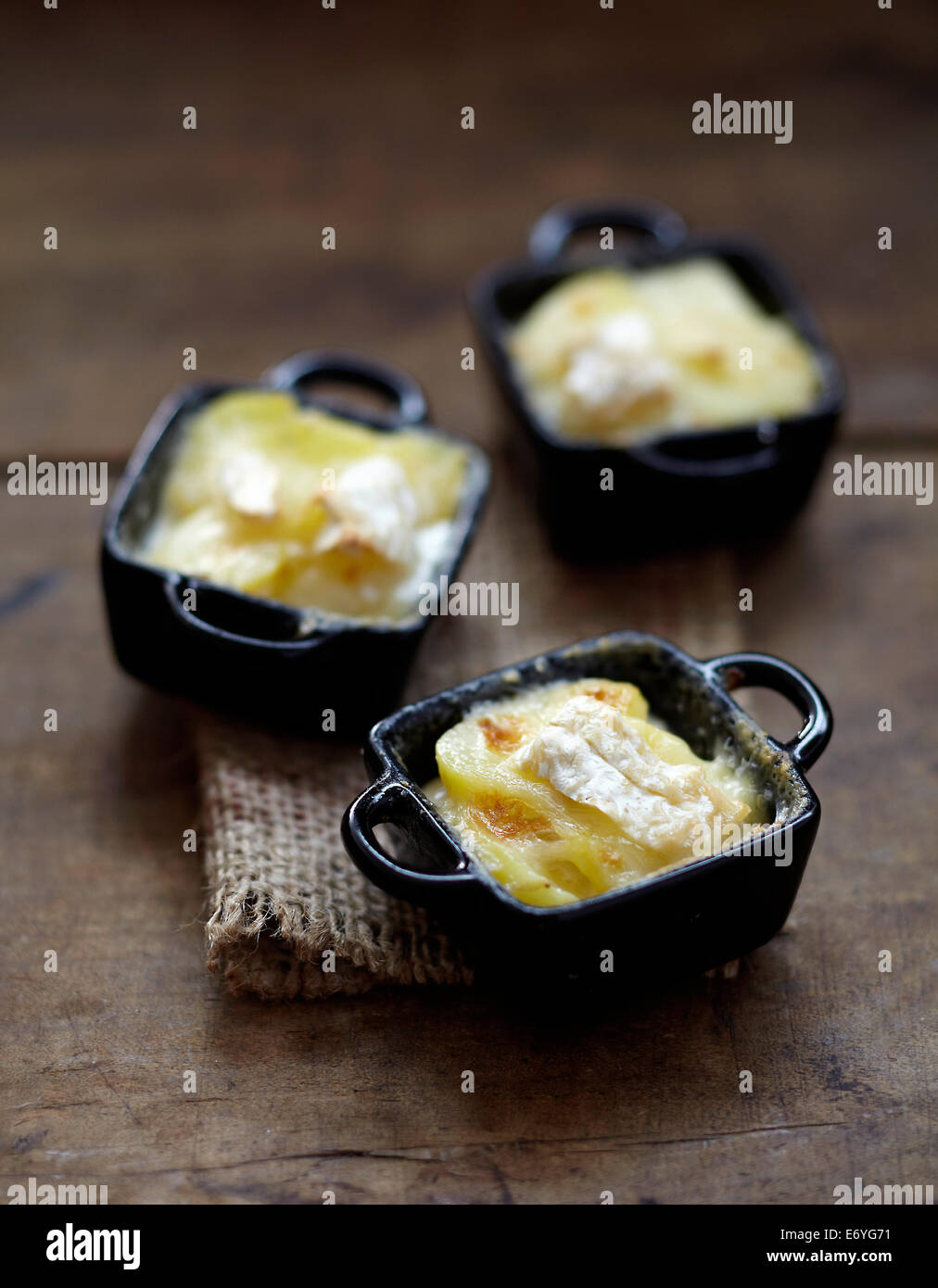 Camembert Tartiflette mini casseroles Stock Photo