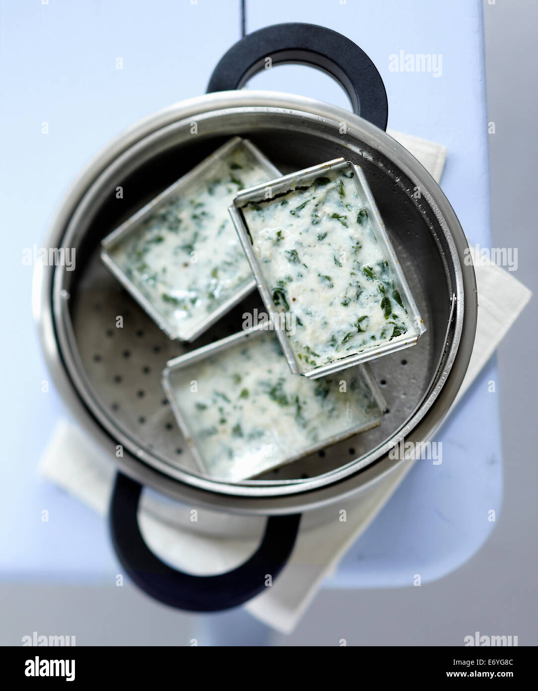 Steamcooking fish and spinach terrine Stock Photo Alamy