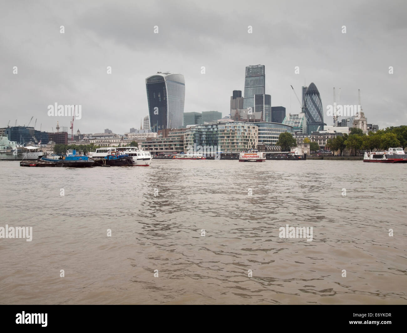 The skyline of the financial district, the city of London, viewed from the thames on a grey overcast day Stock Photo