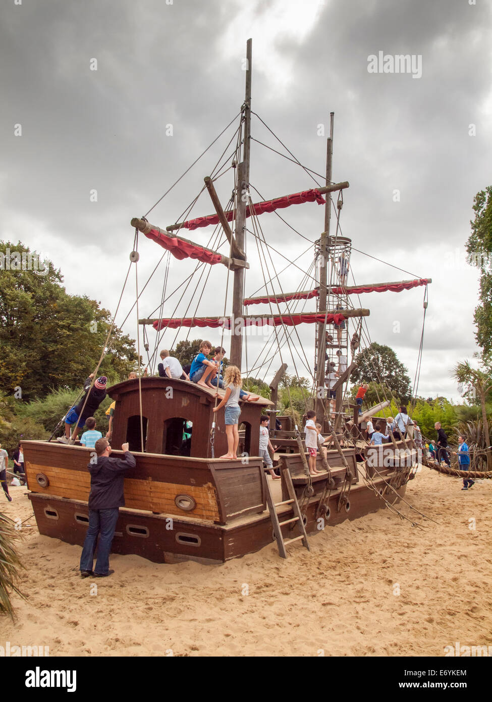 children playing on the pirate ship Diana's memorial playground kensington gardens london on an overcast cloudy day Stock Photo