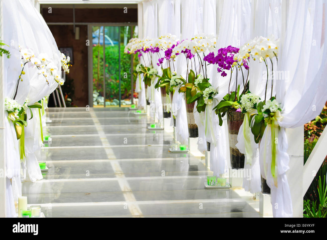 Wedding Corridor Decorated With White Clothes And Orchid Flowers