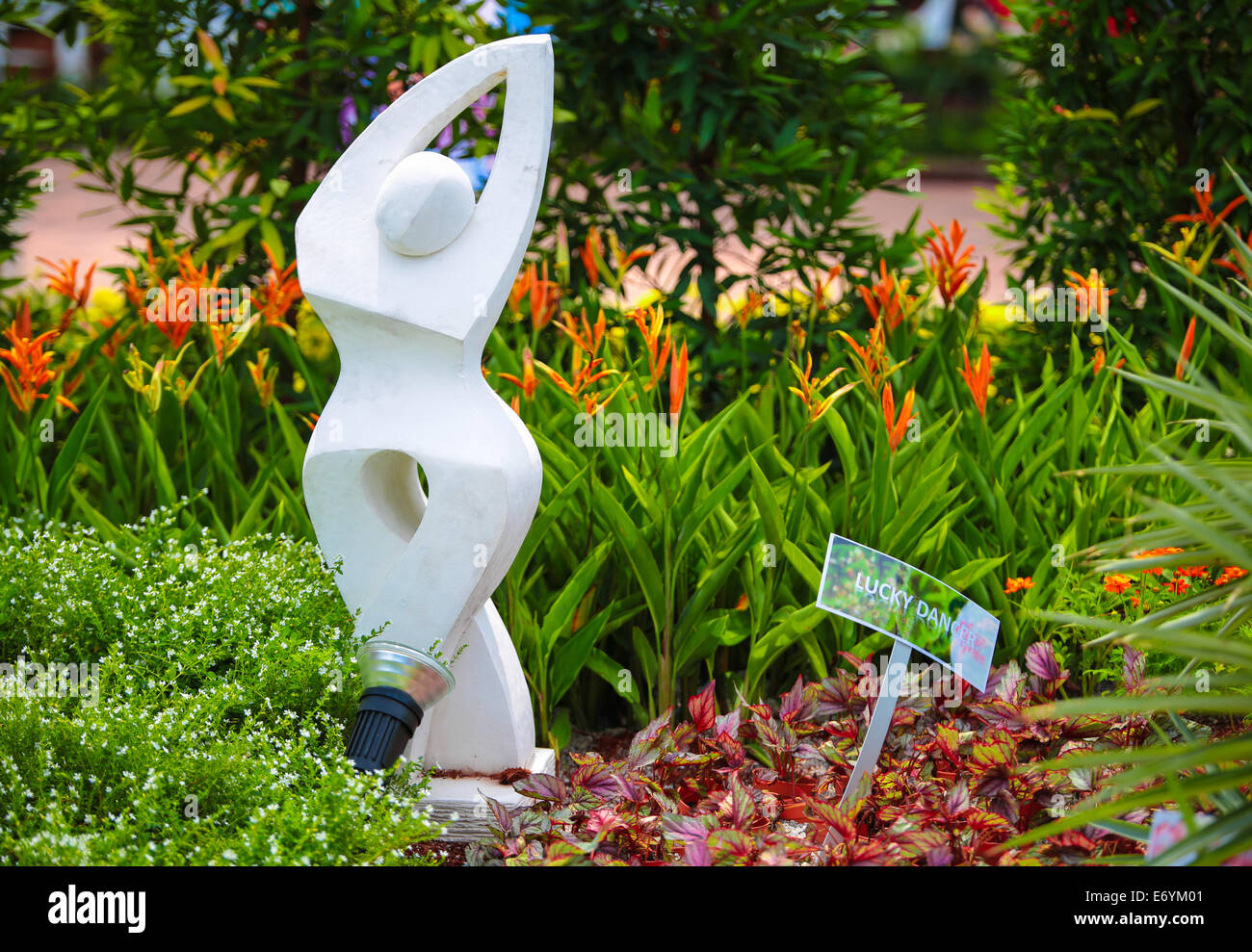 Cement statue title happy dancer in a garden Stock Photo Alamy