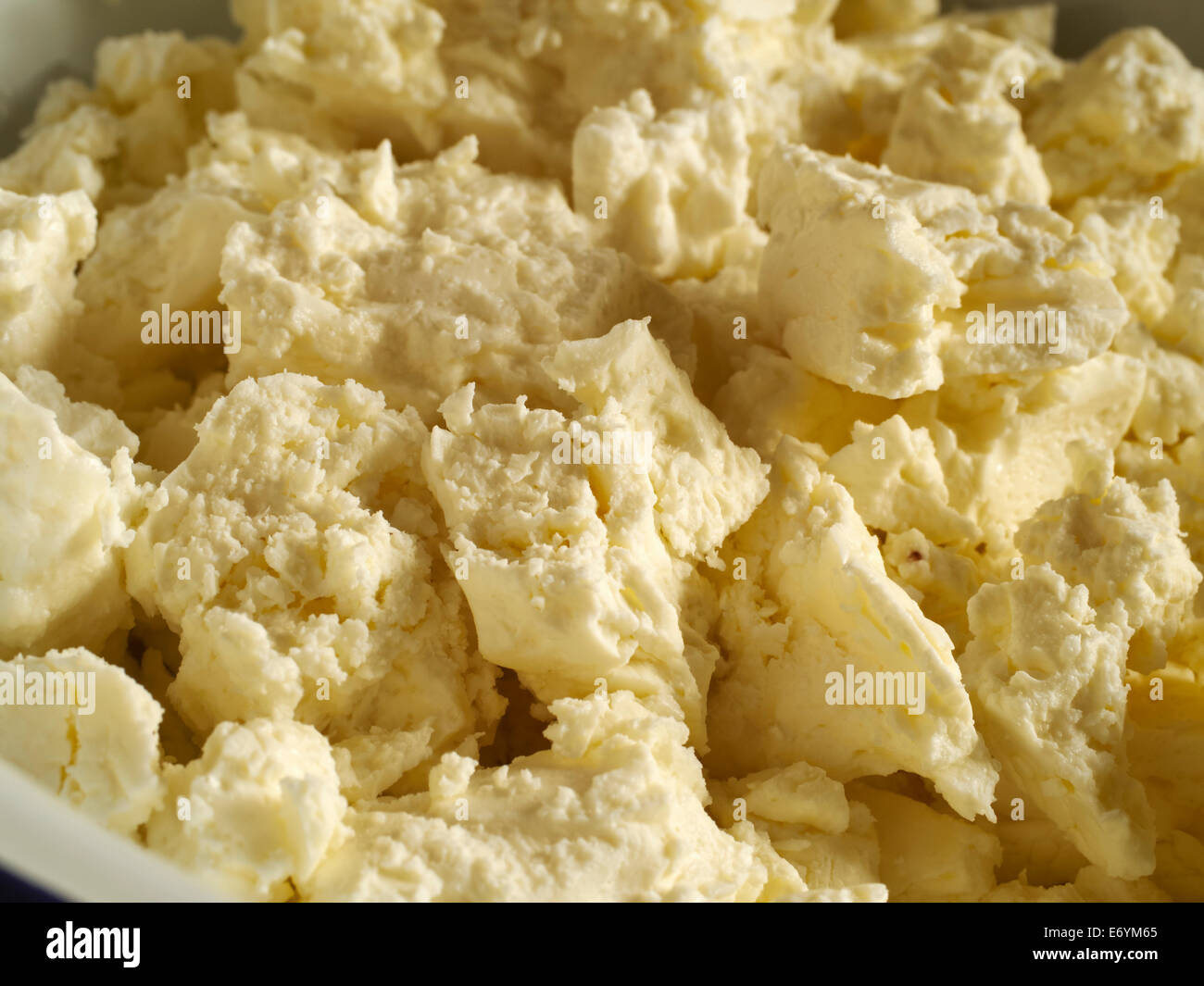 Bowl of crumbled feta cheese Stock Photo