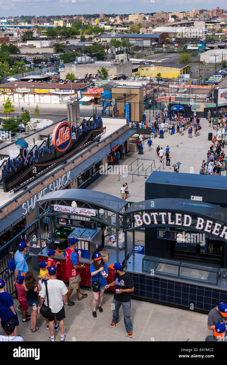 Spectators enjoy refreshments, during a game, along the outfield Concourse at Citi Field Stadium, home to the  New York Mets. Stock Photo