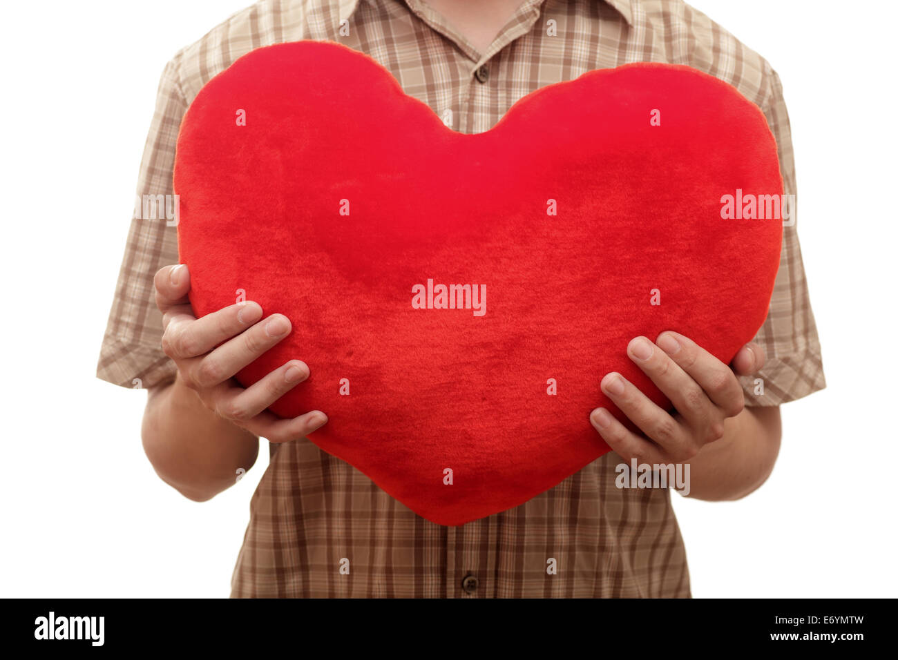 Young man with heart in hands against white background. Close-up Stock ...