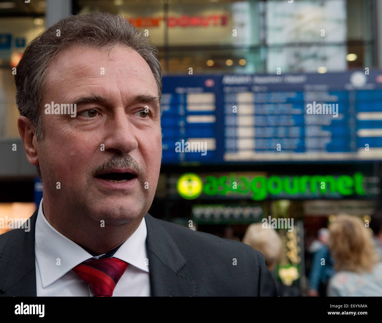 Berlin, Germany. 01st Sep, 2014. Chairman of the German Train Drivers' Union (GDL), Claus Weselsky, gives an interview on the warning strike at the central train station in Berlin, Germany, 01 September 2014. The German Train Drivers' Union (GDL) is currently conducting wage negotiations with German railway company Deutsche Bahn AG and had called for a warning strike from 6 to 9 PM CET. Photo: SOEREN STACHE/DPA/Alamy Live News Stock Photo