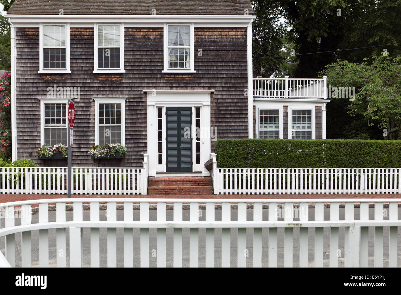 White Picket Fences and clapboard house in Nantucket Town Massachusetts New England USA Stock Photo