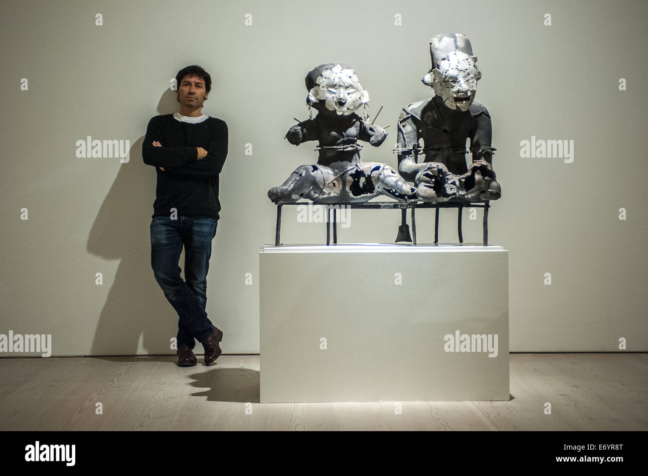 London, UK. 2nd Sept, 2014. Artist Xavier Mascaró poses next to his work 'Sacred Couple'. Xavier Mascaró's first UK solo exhibition will run from 3 September until 5 October at Saatchi Gallery. Credit:  Piero Cruciatti/Alamy Live News Stock Photo