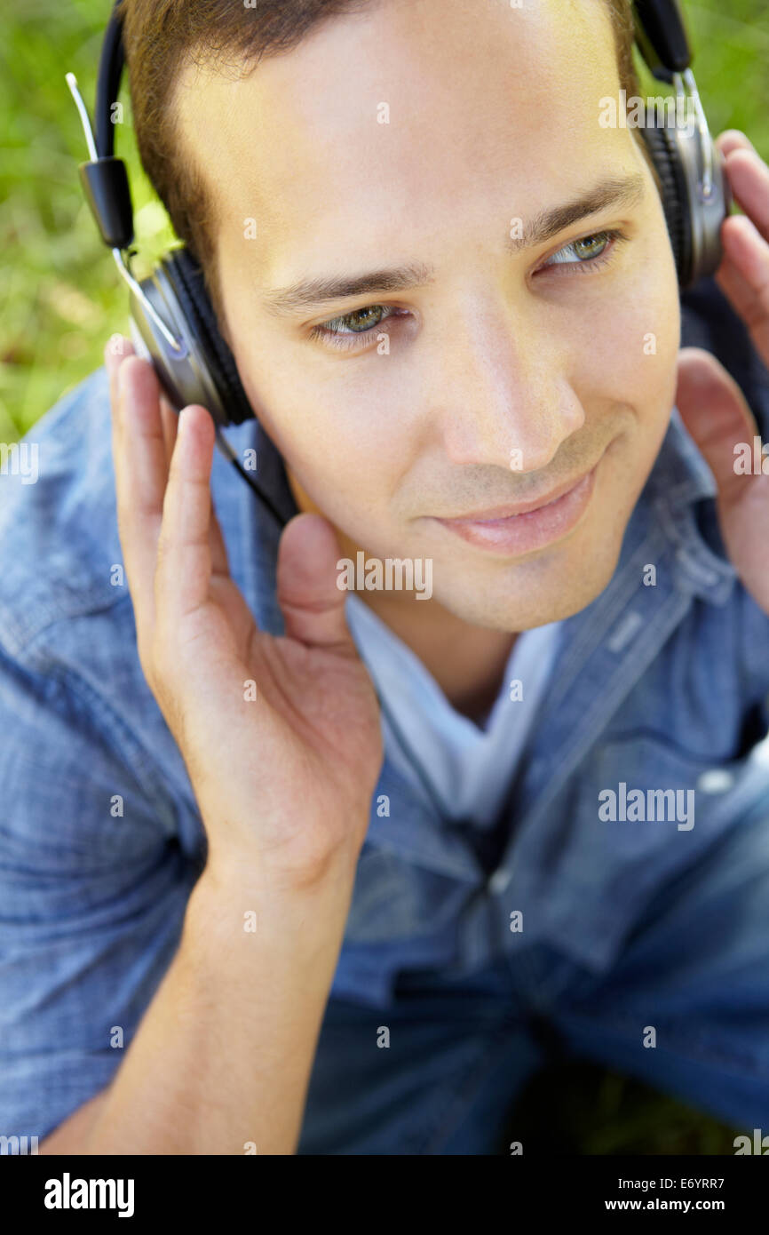 Man relaxing in park headphones hi-res stock photography and images - Alamy