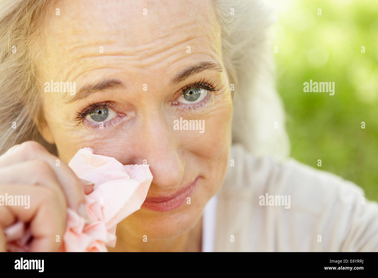 Senior woman with hay fever Stock Photo