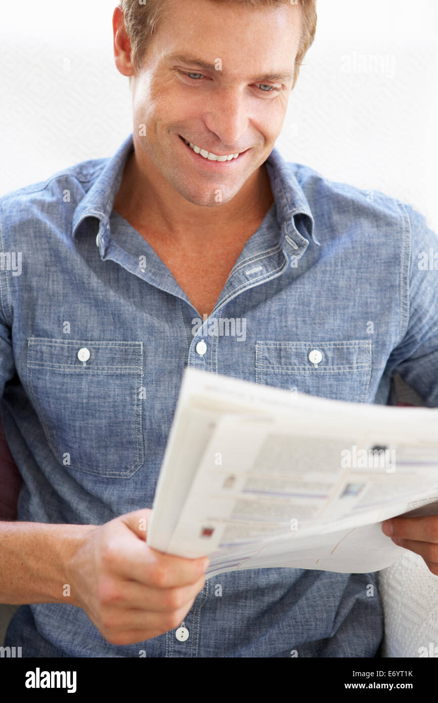 Man reading instruction book Stock Photo
