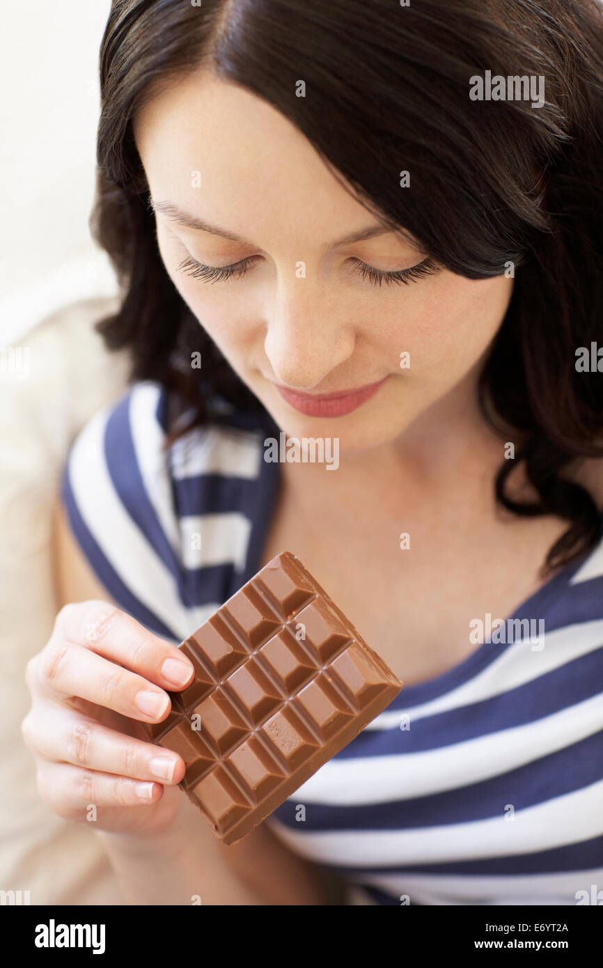 Woman eating chocolate Stock Photo