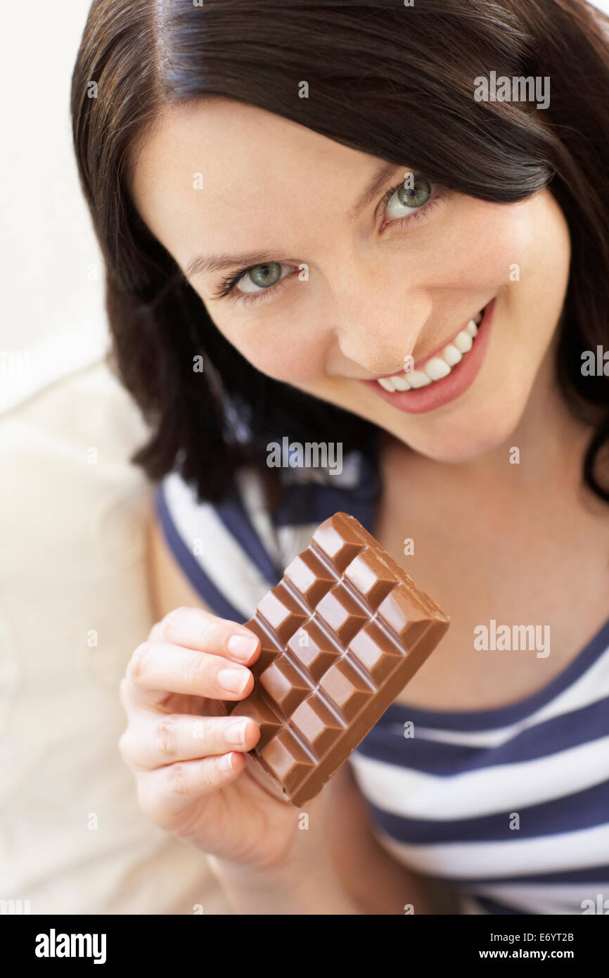 Woman eating chocolate Stock Photo