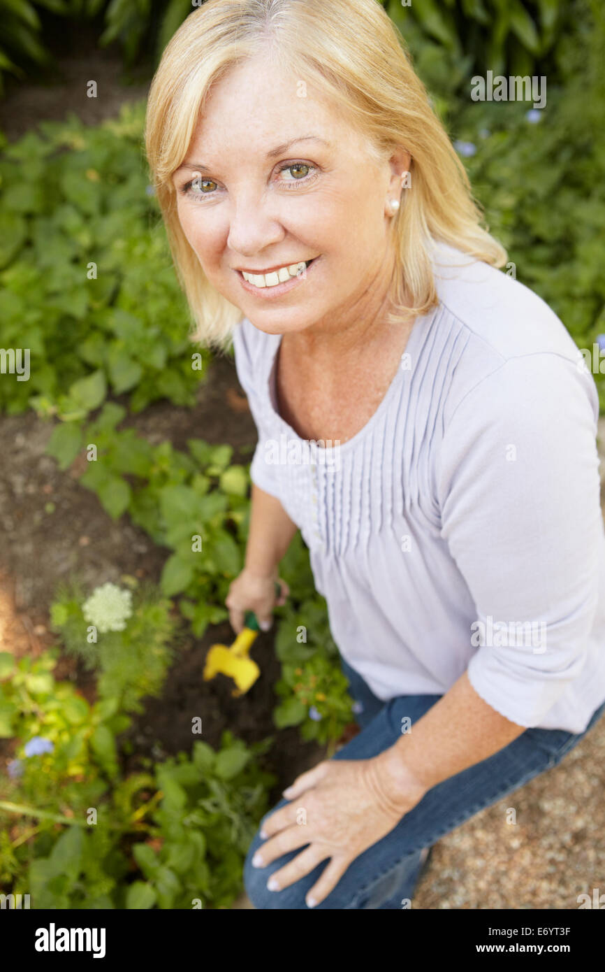 Senior woman gardening Stock Photo - Alamy
