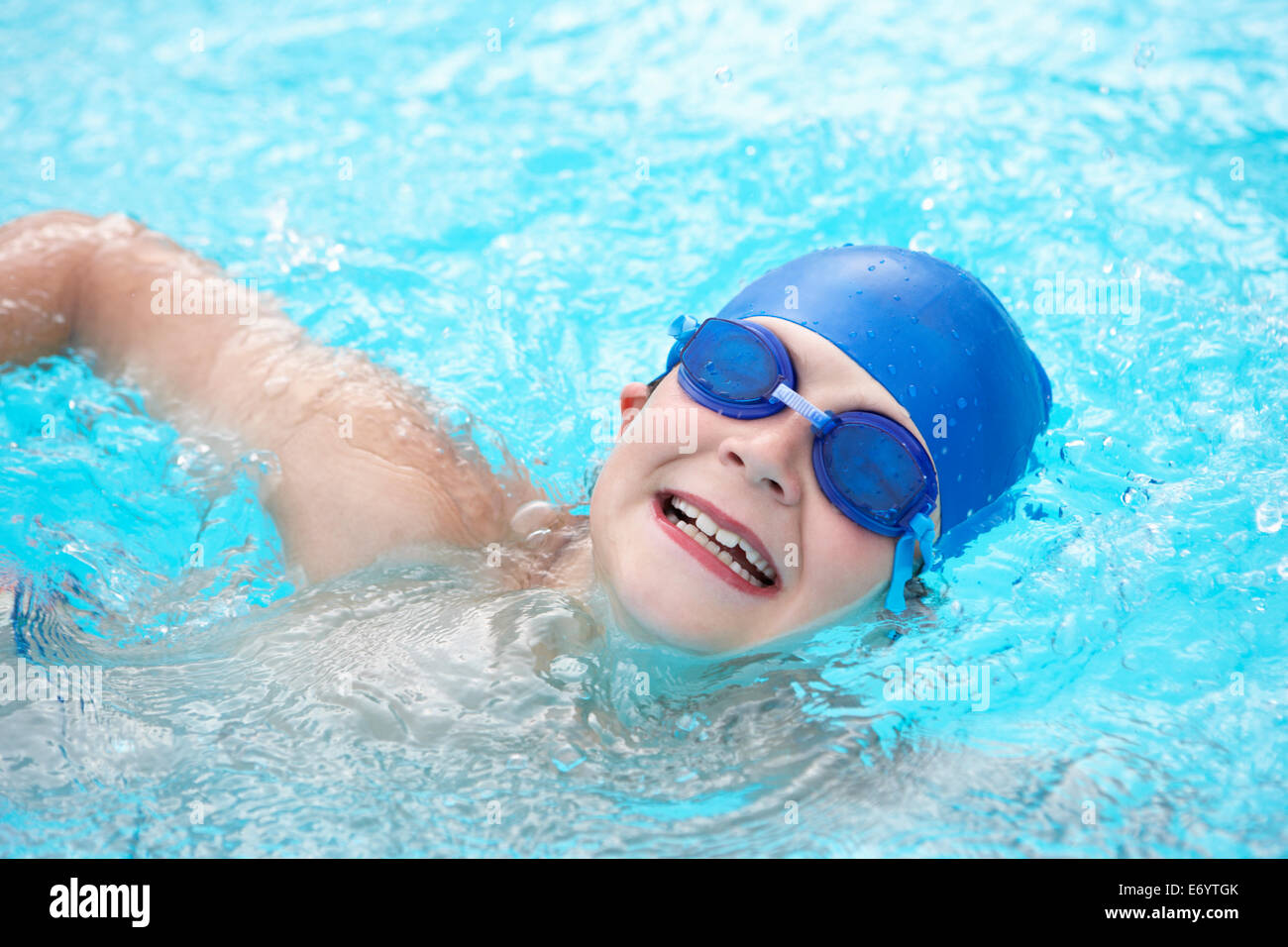 Boy swimming in outdoor pool Stock Photo Alamy