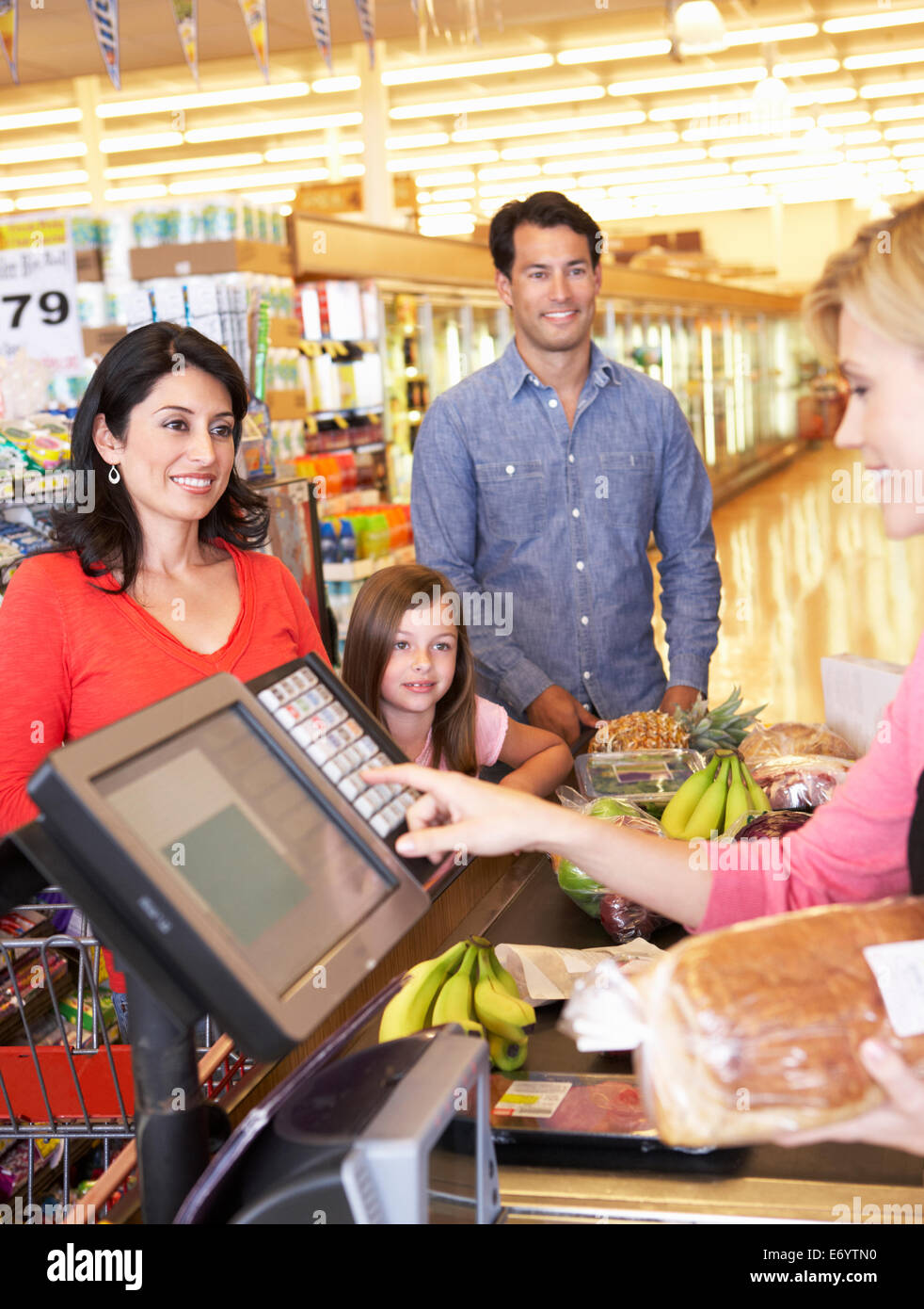 People at supermarket checkout Stock Photo