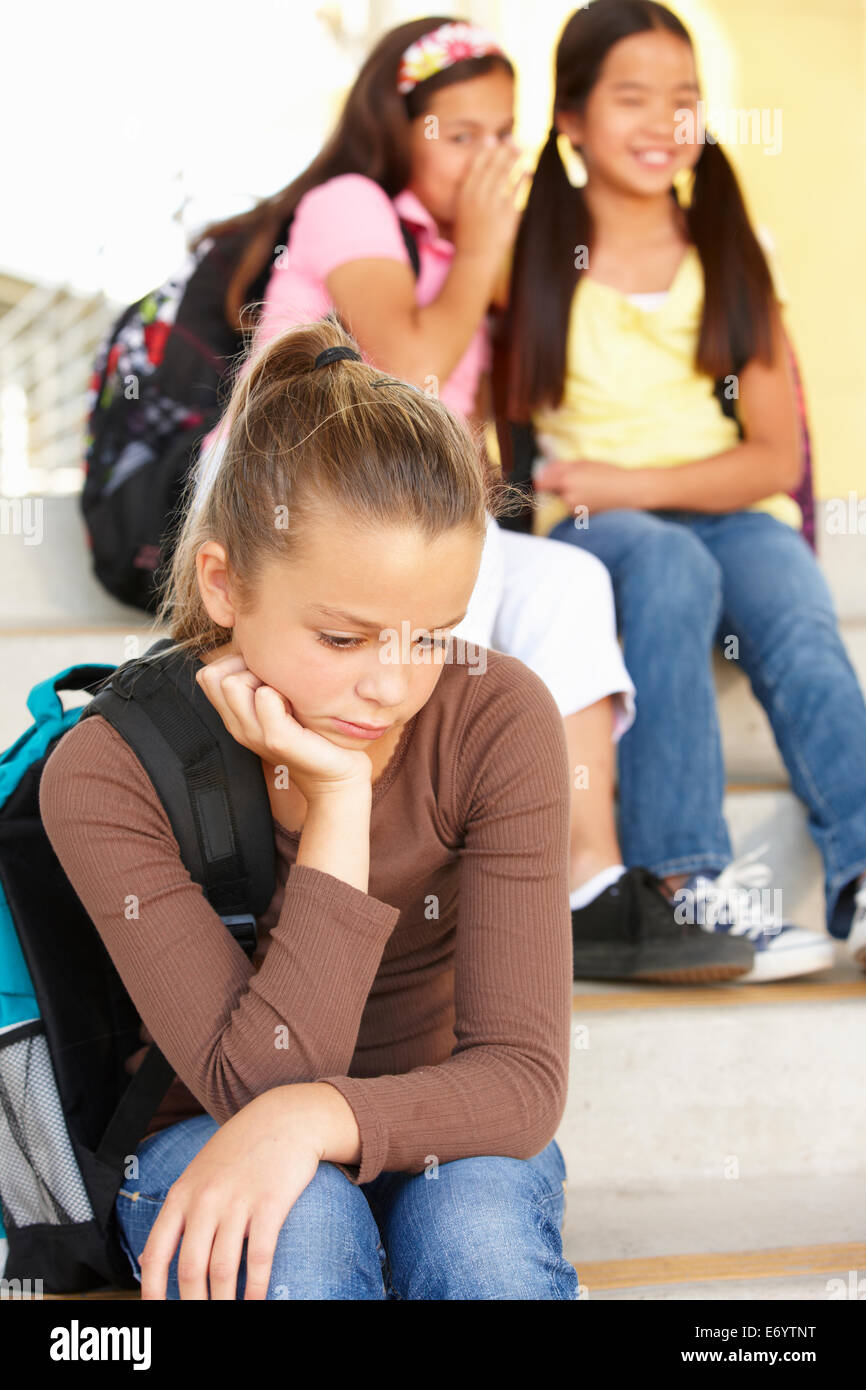 Unhappy Pre teen girl in school Stock Photo