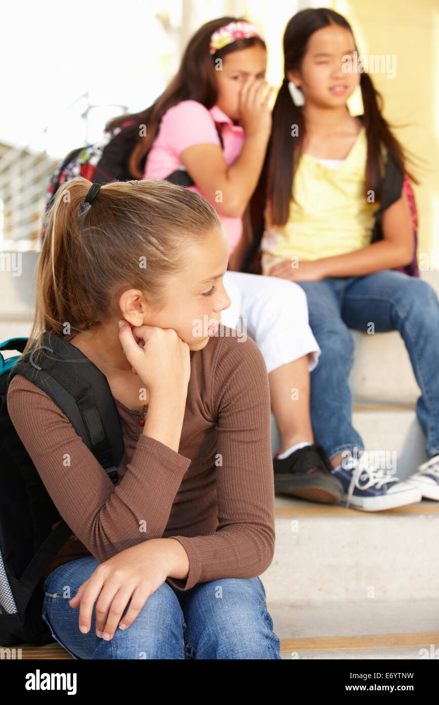 Unhappy Pre teen girl in school Stock Photo