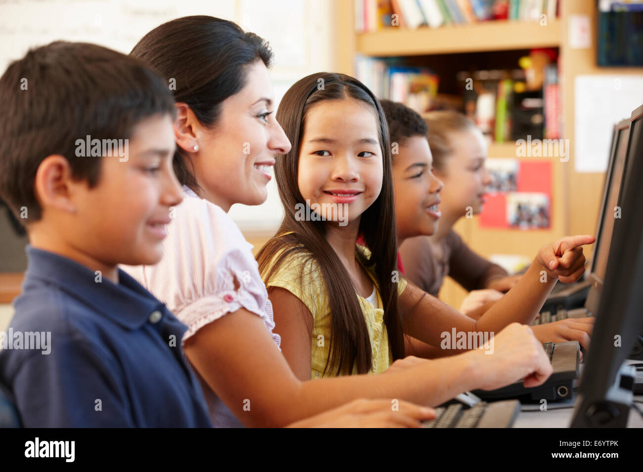 Teacher and schoolchildren in class Stock Photo - Alamy