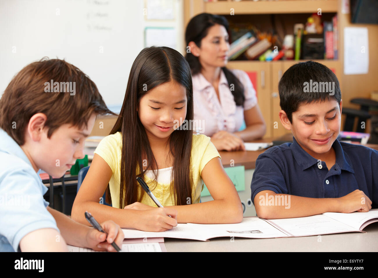 Teacher and schoolchildren in class Stock Photo