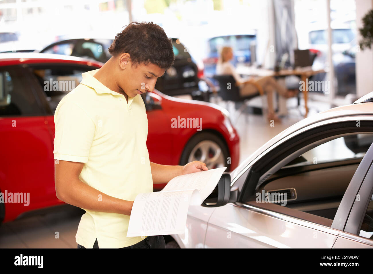Young man buying new car Stock Photo