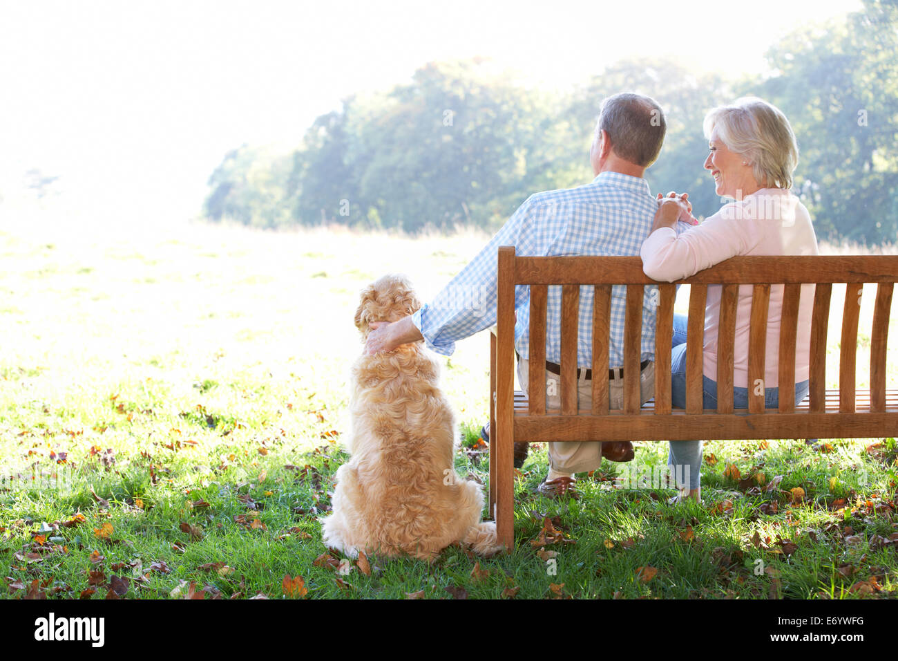 Senior couple outdoors with dog Stock Photo - Alamy