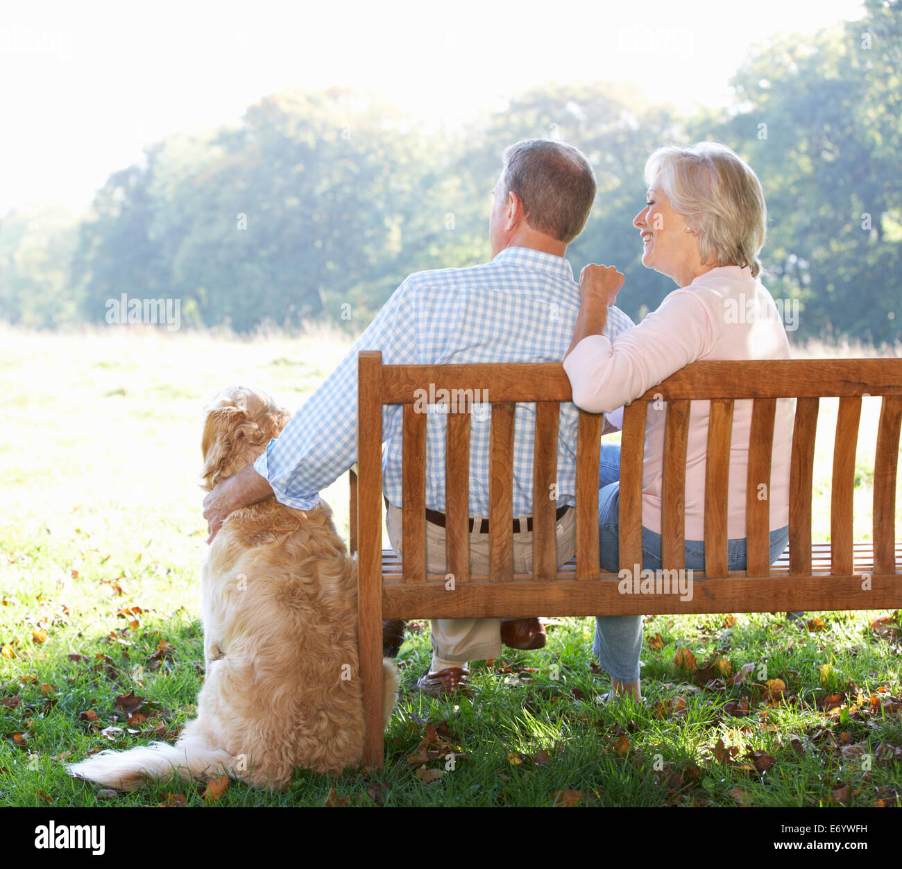 Senior couple outdoors with dog Stock Photo - Alamy