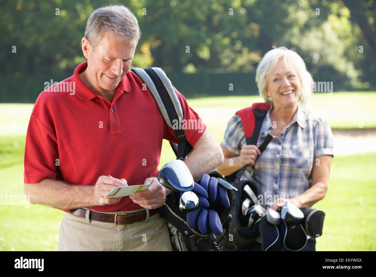 Senior couple on golf course Stock Photo