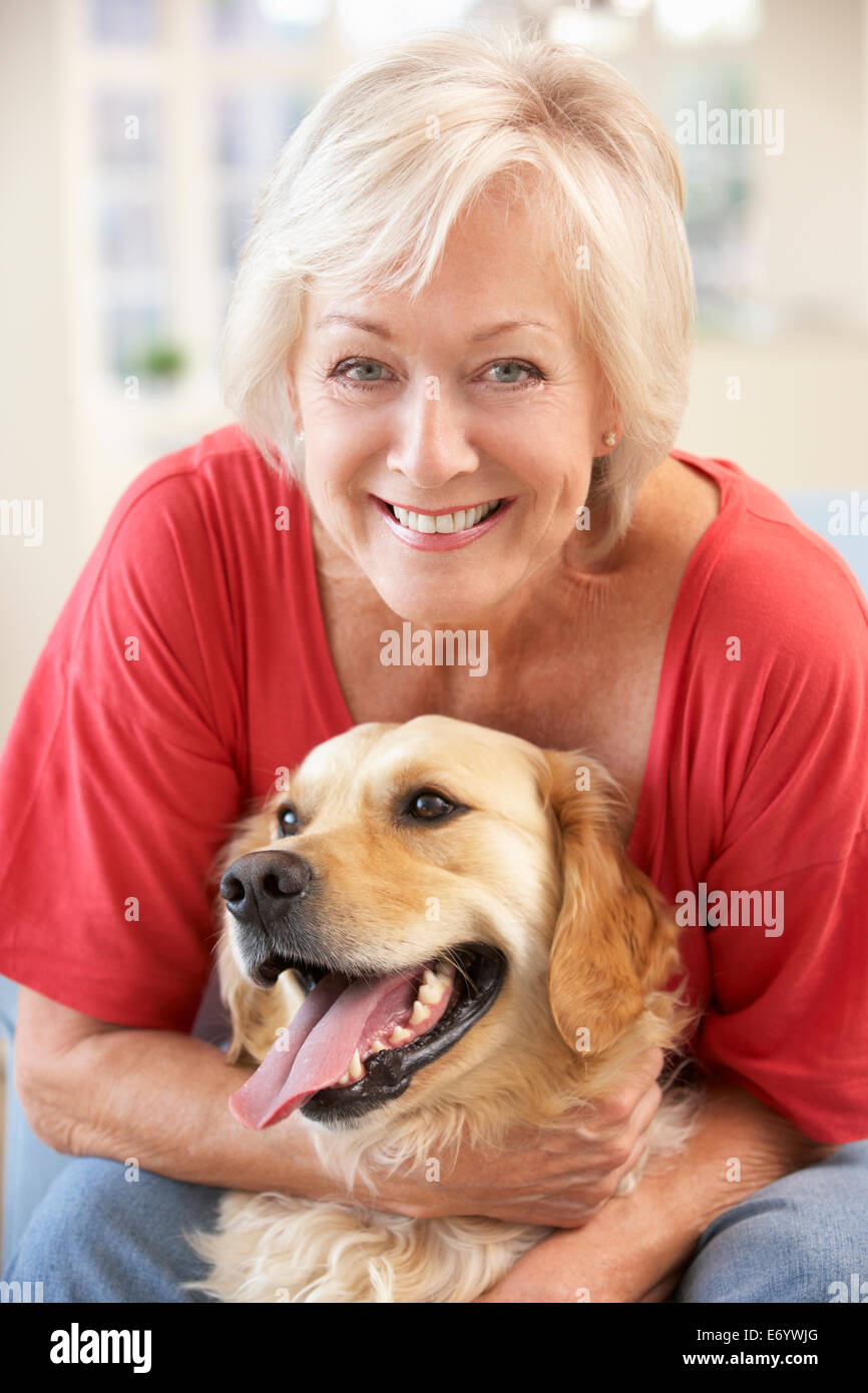 Senior woman at home with dog Stock Photo - Alamy
