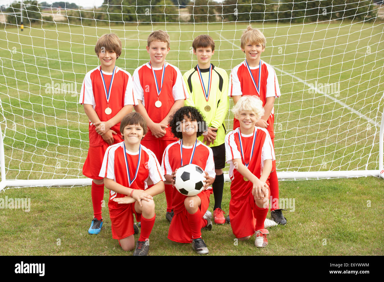 Winning junior football team portrait Stock Photo