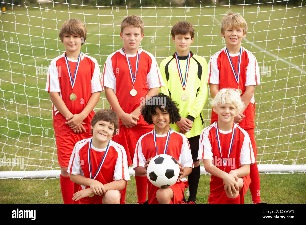 Winning junior soccer team portrait Stock Photo