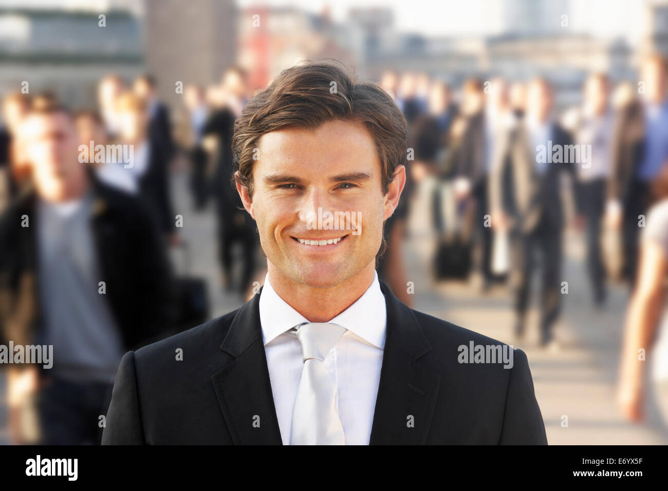 Male commuter in crowd Stock Photo