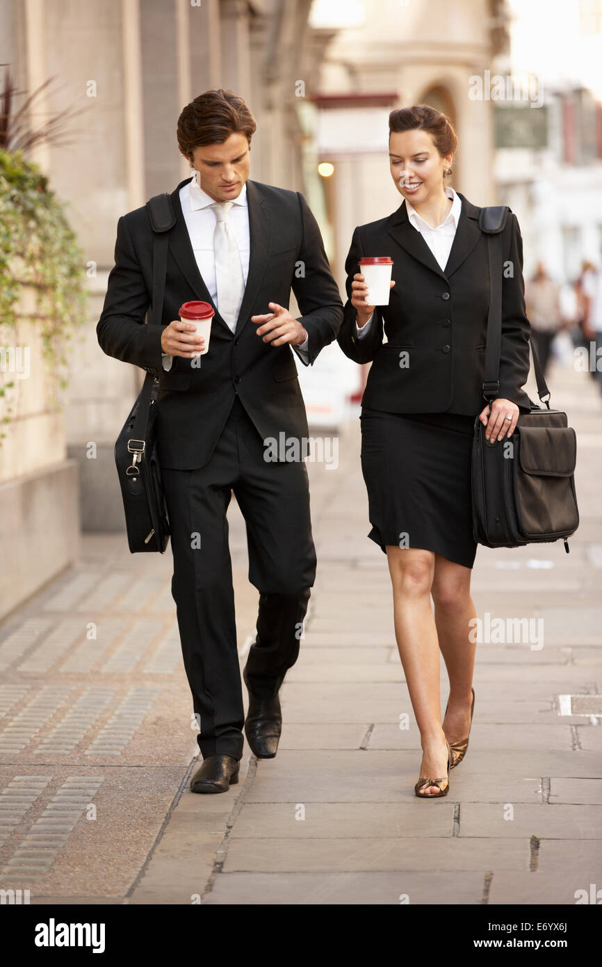 Businessman and businesswoman on their way to work Stock Photo