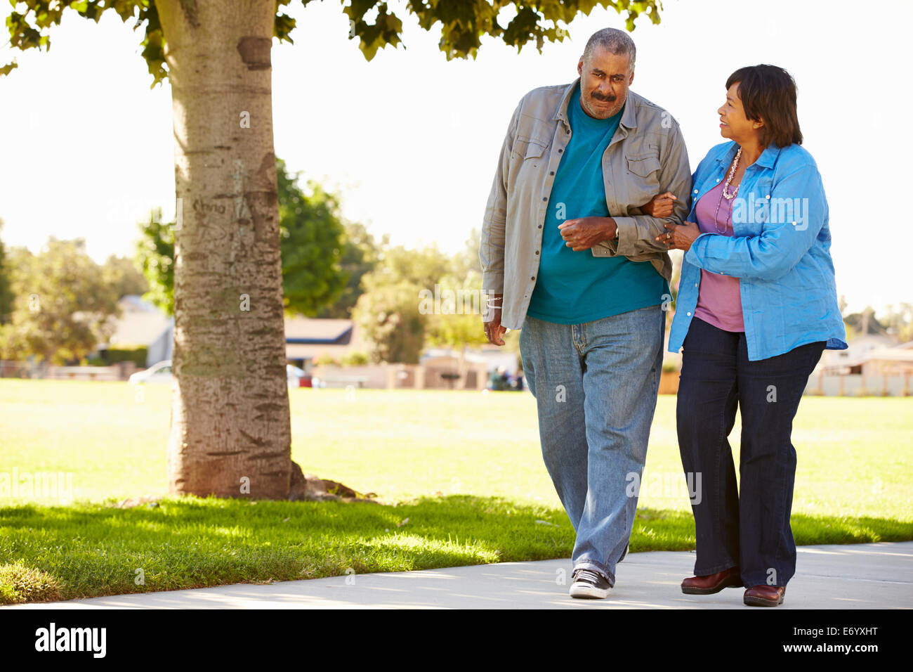 Senior Couple Walking In Park Together Stock Photo - Alamy