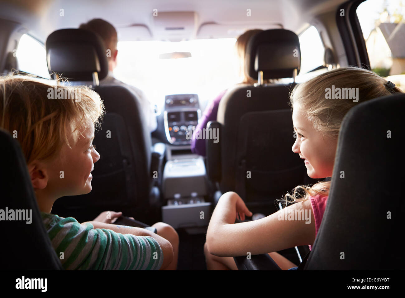 Children In Back Seat Of Car On Journey With Parents Stock Photo Alamy