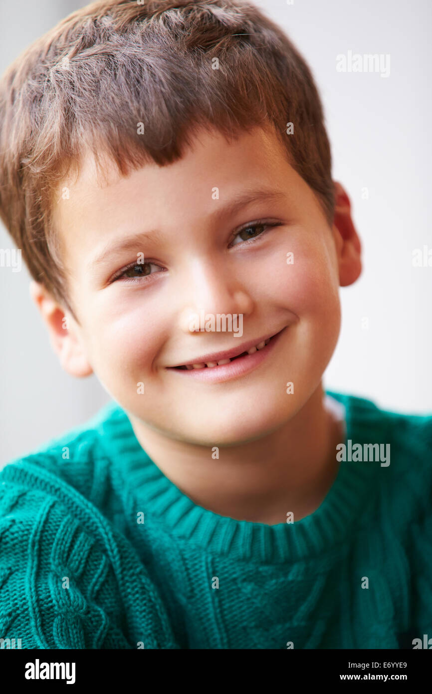 Indoor Portrait Of Boy Wearing Jumper Stock Photo