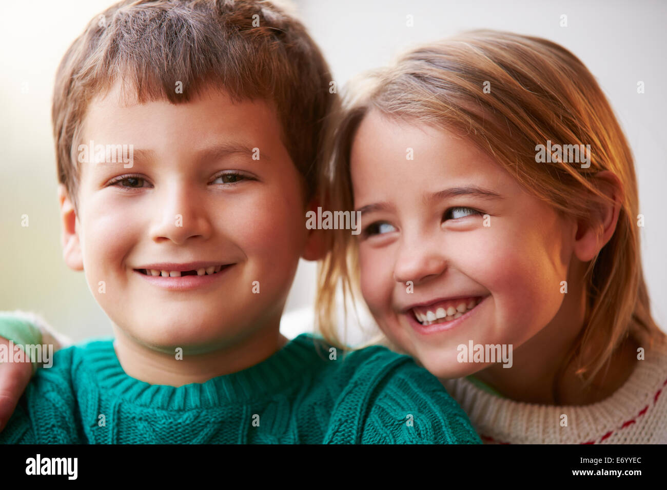 Indoor Portrait Of Brother And Sister Stock Photo