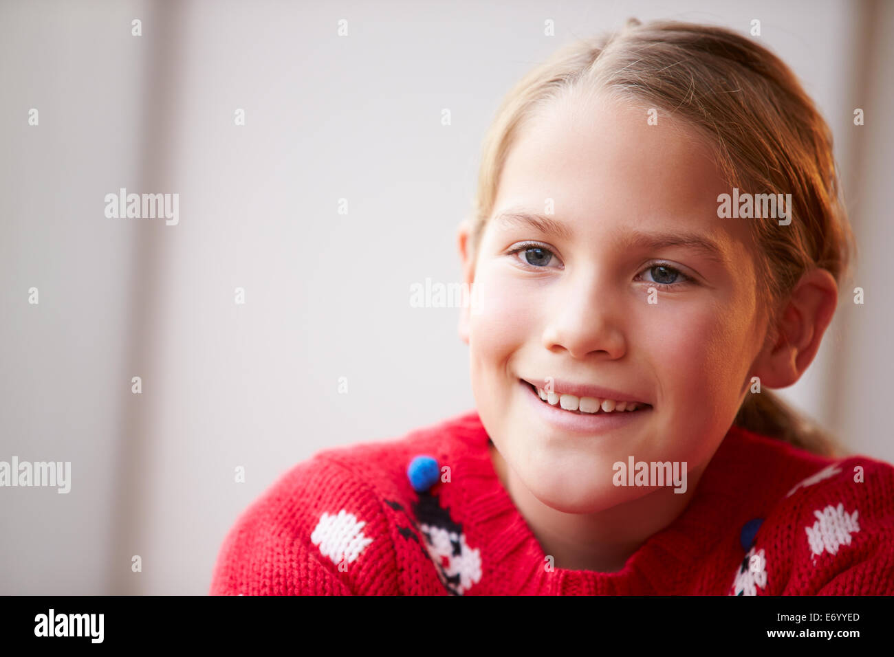 Portrait Of Girl Wearing Christmas Jumper Stock Photo