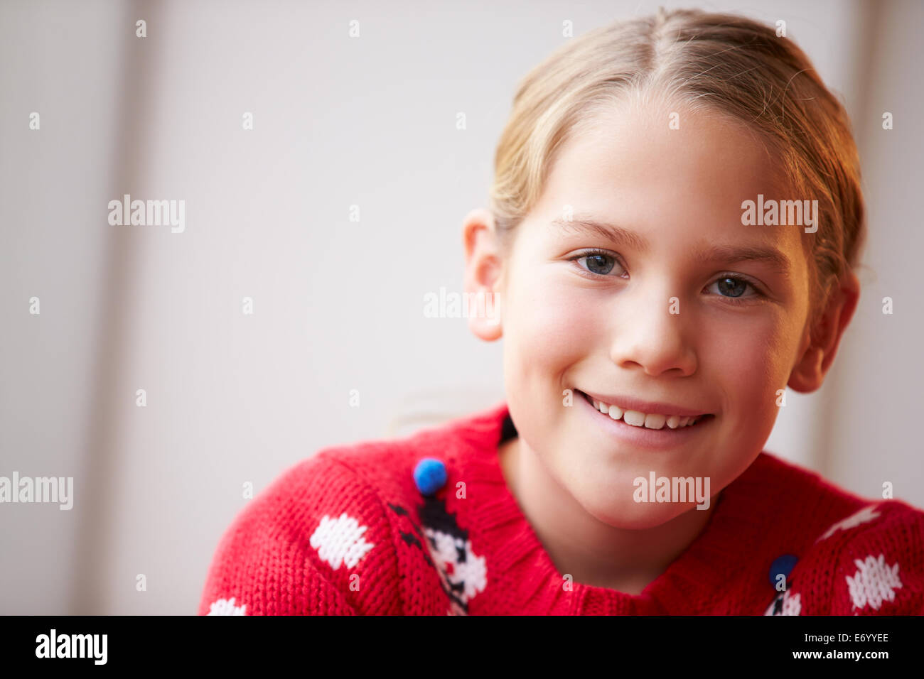 Portrait Of Girl Wearing Christmas Jumper Stock Photo