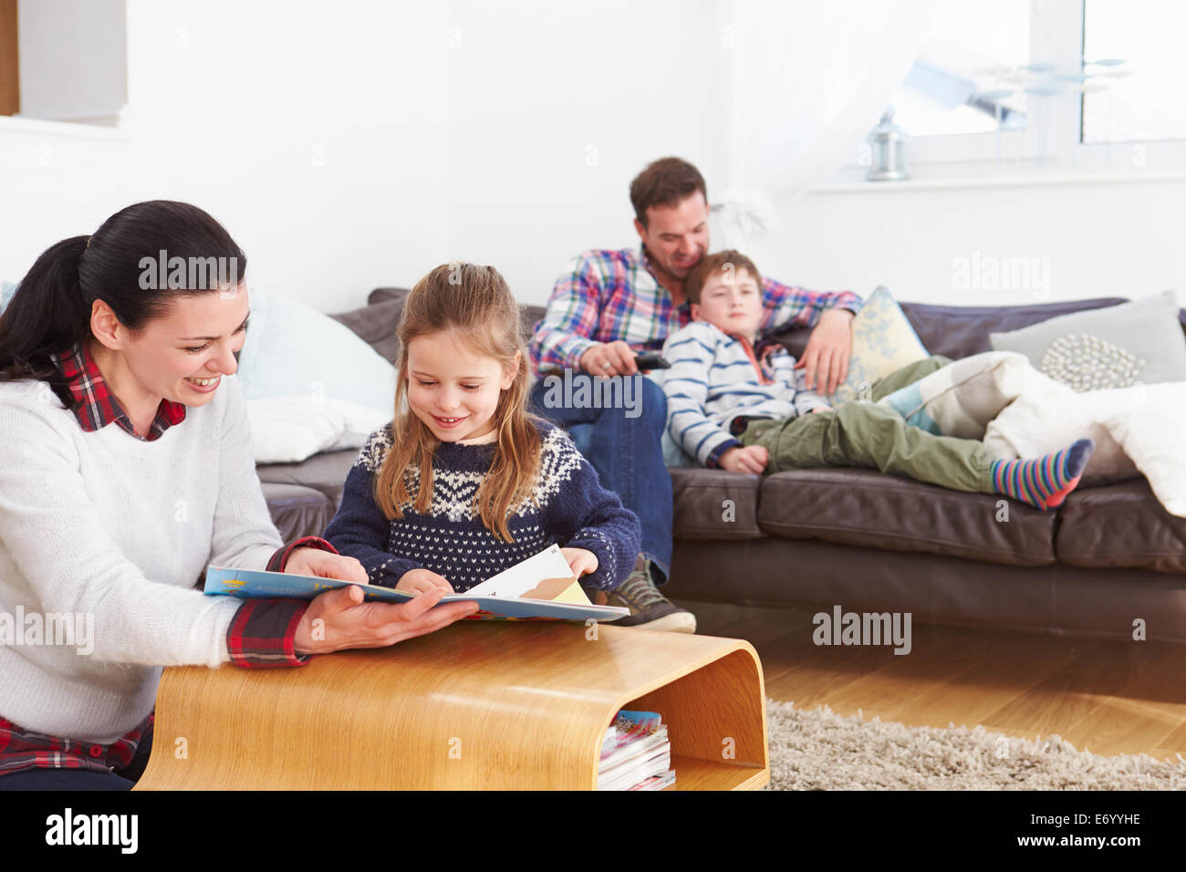 Family Relaxing Indoors Together Stock Photo