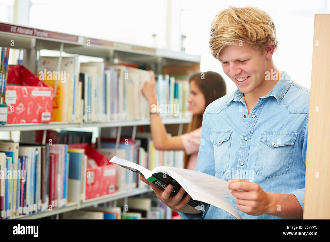 Two College Students Studying In Library Stock Photo